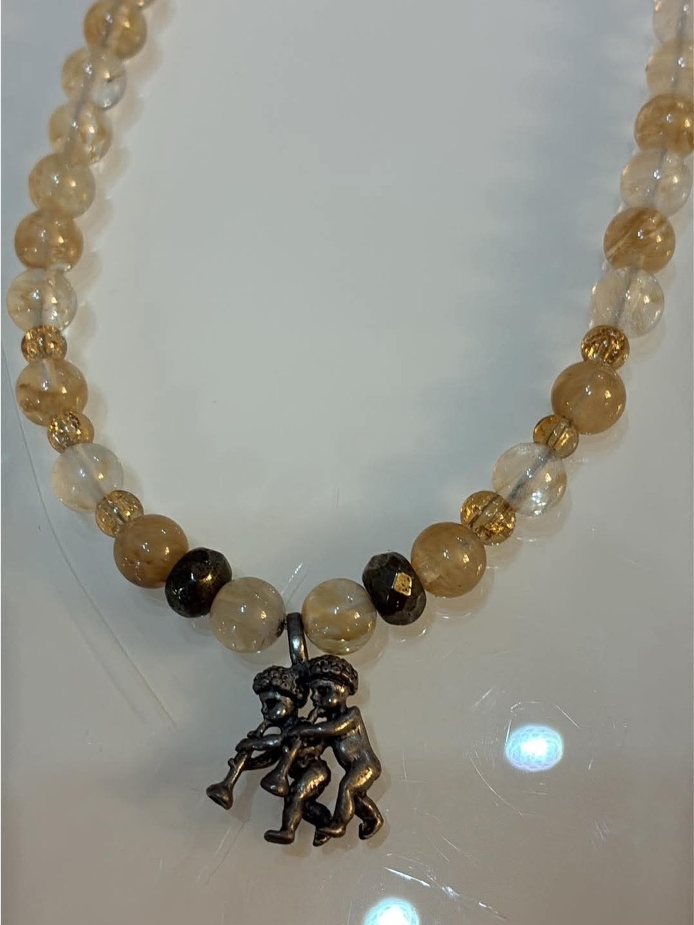 Beaded Cherub Pendant Necklace in Amber and Clear Tones